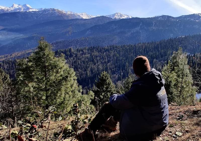 Uttarakhand Himalayas — snow-covered peaks and dense forests